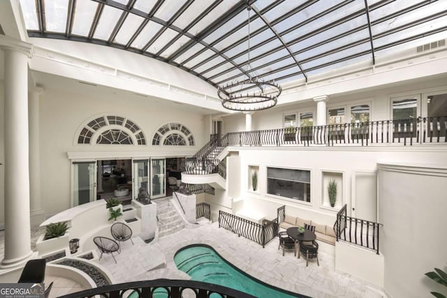 3511 Roxboro Rd NE, Atlanta, GA 30326 - interior space featuring stairway, an outdoor pool, french doors, a patio, and stucco siding