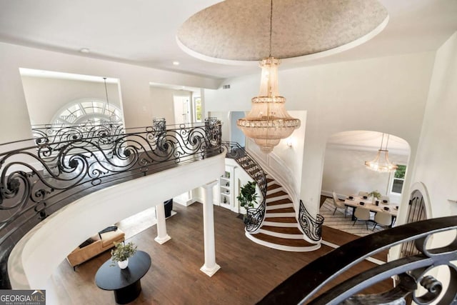 3511 Roxboro Rd NE, Atlanta, GA 30326 - stairway with arched walkways, wood finished floors, and plenty of natural light