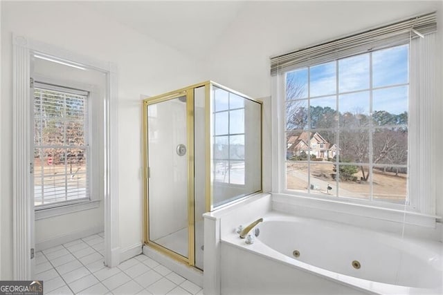 1268 Windsor Glen Dr, Douglasville, GA 30134 - bathroom with a healthy amount of sunlight, tile patterned flooring, a whirlpool tub, and a stall shower