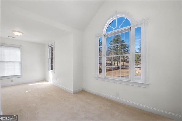1268 Windsor Glen Dr, Douglasville, GA 30134 - carpeted empty room featuring vaulted ceiling, visible vents, and baseboards