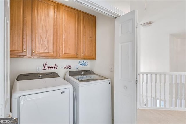1268 Windsor Glen Dr, Douglasville, GA 30134 - laundry area featuring washer and dryer, cabinet space, and visible vents