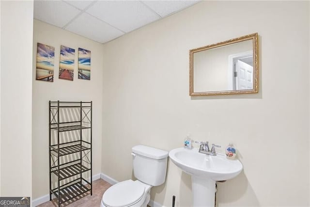 1268 Windsor Glen Dr, Douglasville, GA 30134 - half bath with toilet, baseboards, a drop ceiling, and a sink