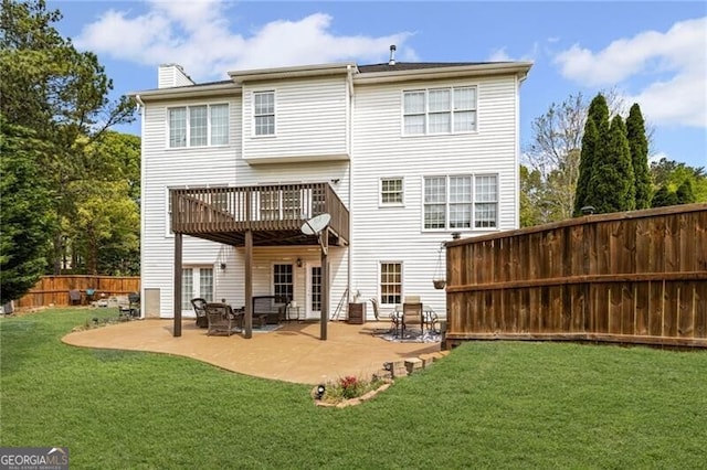 1268 Windsor Glen Dr, Douglasville, GA 30134 - rear view of property featuring a chimney, fence, a yard, and a patio