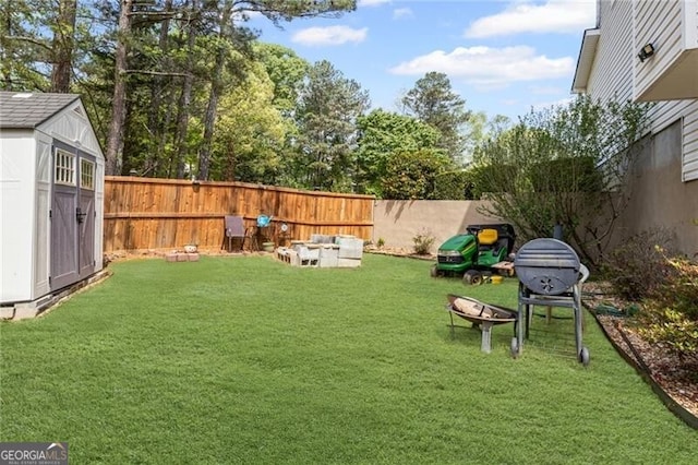 1268 Windsor Glen Dr, Douglasville, GA 30134 - view of yard with a fenced backyard, an outdoor structure, and a storage shed