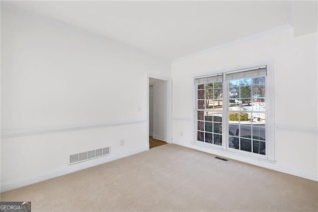 1268 Windsor Glen Dr, Douglasville, GA 30134 - spare room with carpet floors, crown molding, visible vents, and baseboards