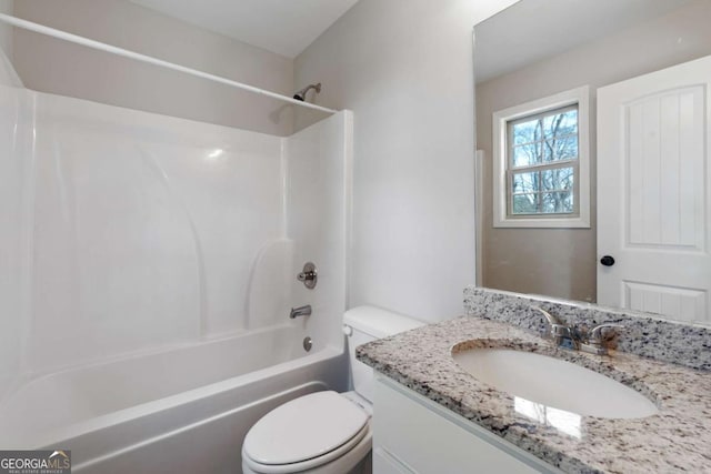 full bath with toilet, vanity, and shower / bathing tub combination