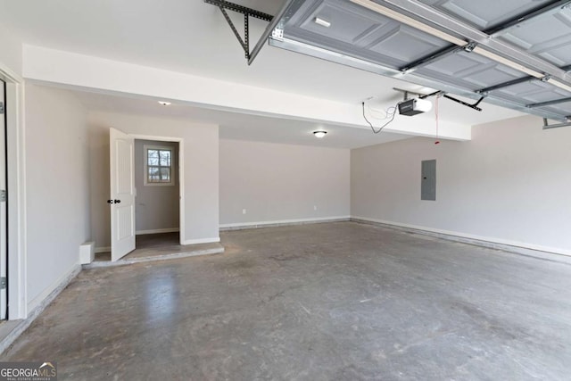 garage with electric panel, baseboards, and a garage door opener