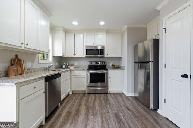 kitchen featuring white cabinets, dark wood-style flooring, and stainless steel appliances