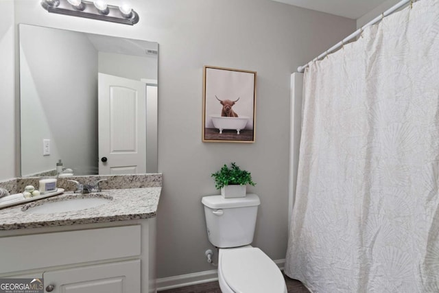 full bath featuring toilet and vanity