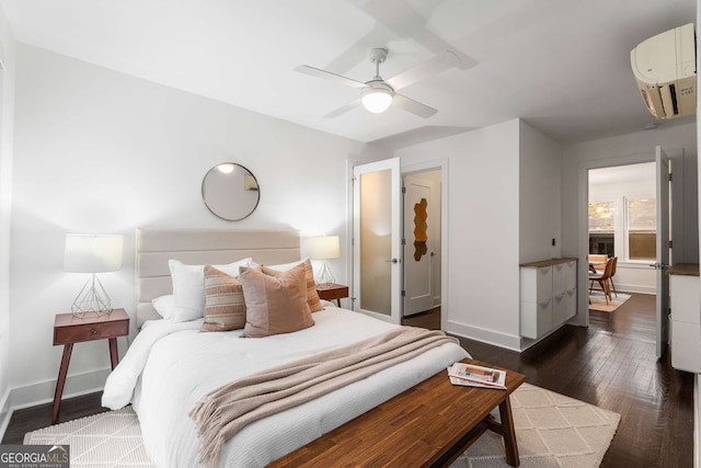 830 Belgrade Ave NE, Atlanta, GA 30306 - bedroom featuring ceiling fan, an AC wall unit, baseboards, and dark wood-style flooring