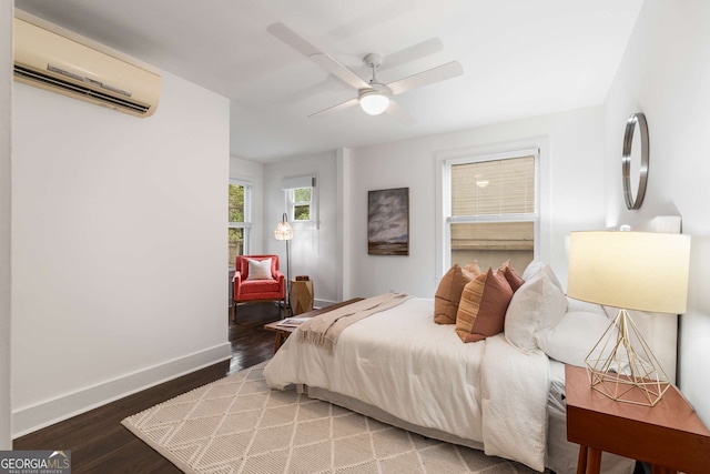 830 Belgrade Ave NE, Atlanta, GA 30306 - bedroom with baseboards, wood finished floors, a wall unit AC, and ceiling fan