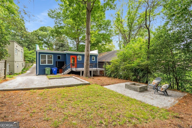 830 Belgrade Ave NE, Atlanta, GA 30306 - rear view of house featuring a fire pit, a yard, a patio area, and a deck
