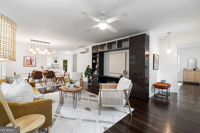 830 Belgrade Ave NE, Atlanta, GA 30306 - living area featuring a wall mounted air conditioner, baseboards, a ceiling fan, and wood finished floors