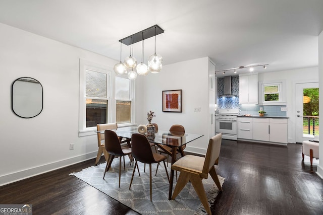 830 Belgrade Ave NE, Atlanta, GA 30306 - dining area featuring track lighting, dark wood finished floors, baseboards, and a notable chandelier