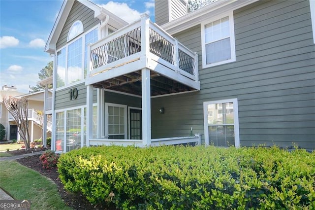 1005 Berkeley Woods Dr, Duluth, GA 30096 - rear view of property with a chimney and a balcony