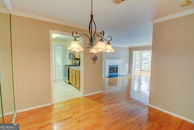 1005 Berkeley Woods Dr, Duluth, GA 30096 - unfurnished dining area with ornamental molding, light wood finished floors, a tile fireplace, baseboards, and a chandelier