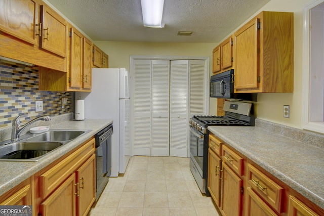 1005 Berkeley Woods Dr, Duluth, GA 30096 - kitchen with black appliances, a sink, a textured ceiling, light countertops, and backsplash