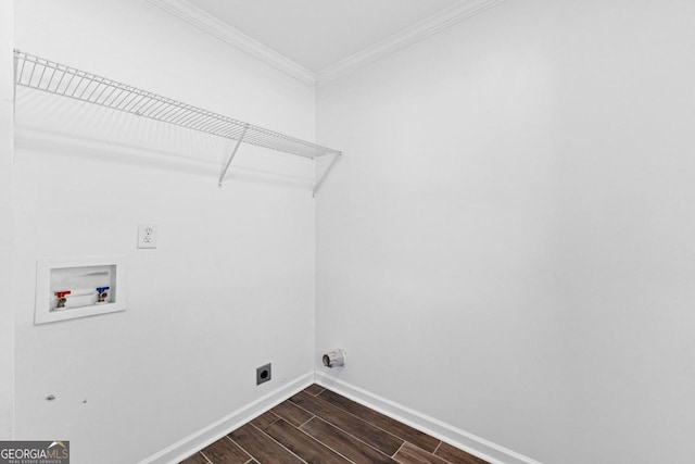 clothes washing area featuring laundry area, crown molding, baseboards, washer hookup, and wood finish floors