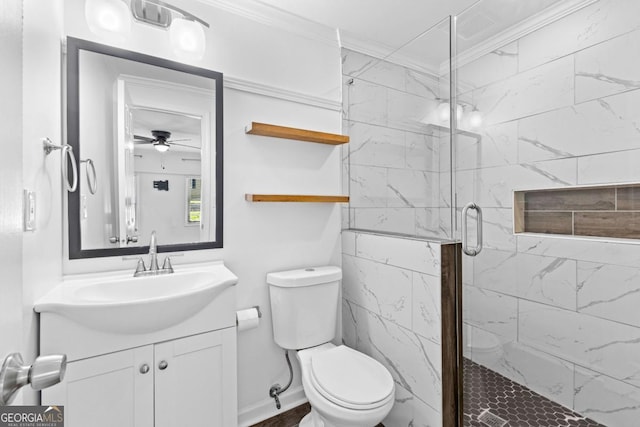 full bathroom with toilet, vanity, ornamental molding, a stall shower, and ceiling fan