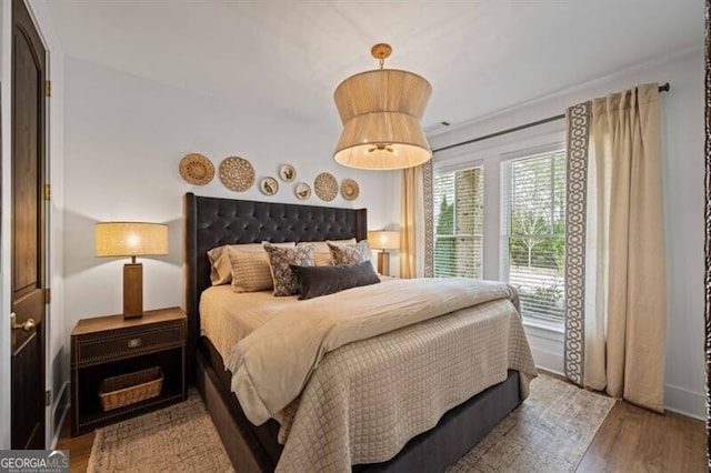 bedroom with wood finished floors