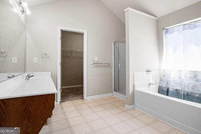 1502 Silver Mist Cir, Powder Springs, GA 30127 - full bath with tile patterned floors, a shower stall, a garden tub, vanity, and a walk in closet