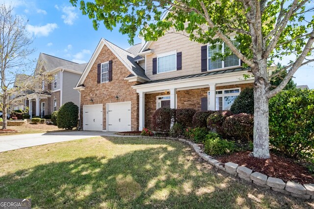 1502 Silver Mist Cir, Powder Springs, GA 30127 - traditional-style house featuring a front lawn, an attached garage, a standing seam roof, driveway, and metal roof