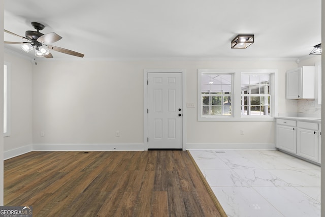 1271 Hayes St, Madison, GA 30650 - interior space featuring a ceiling fan, baseboards, and crown molding