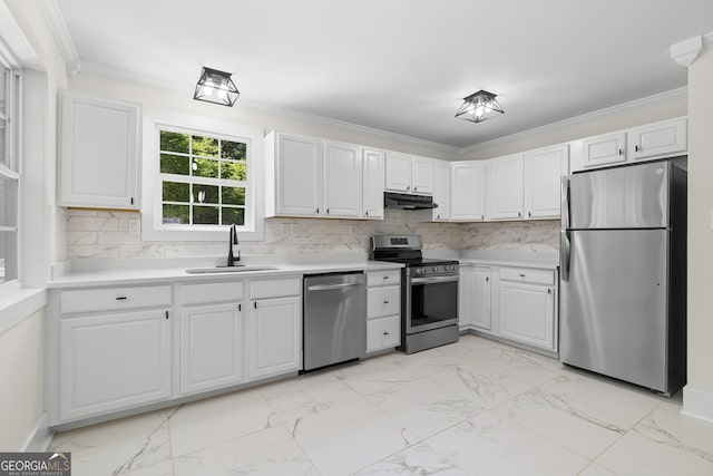 1271 Hayes St, Madison, GA 30650 - kitchen featuring stainless steel appliances, a sink, marble finish floor, light countertops, and under cabinet range hood