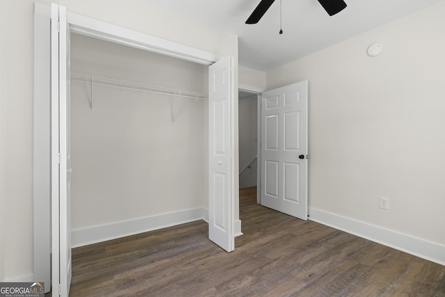 1271 Hayes St, Madison, GA 30650 - unfurnished bedroom featuring dark wood finished floors, a closet, a ceiling fan, and baseboards