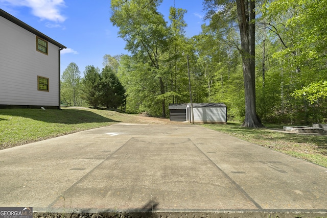 1271 Hayes St, Madison, GA 30650 - view of patio / terrace with an outbuilding and a storage shed