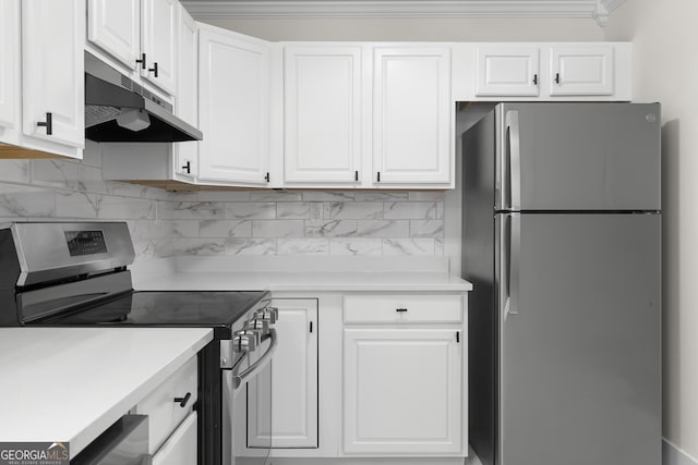 1271 Hayes St, Madison, GA 30650 - kitchen with light countertops, under cabinet range hood, white cabinets, and stainless steel appliances