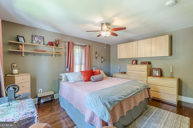 bedroom with dark wood finished floors, baseboards, and a ceiling fan