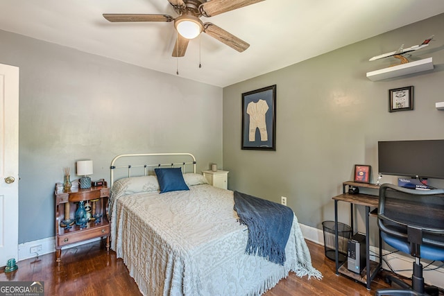 bedroom featuring wood finished floors, baseboards, and ceiling fan