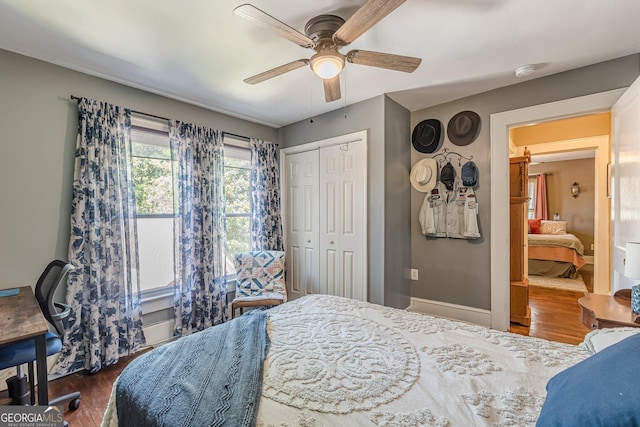 bedroom featuring a ceiling fan, wood finished floors, and a closet