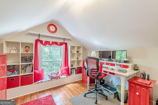 home office featuring vaulted ceiling and wood finished floors