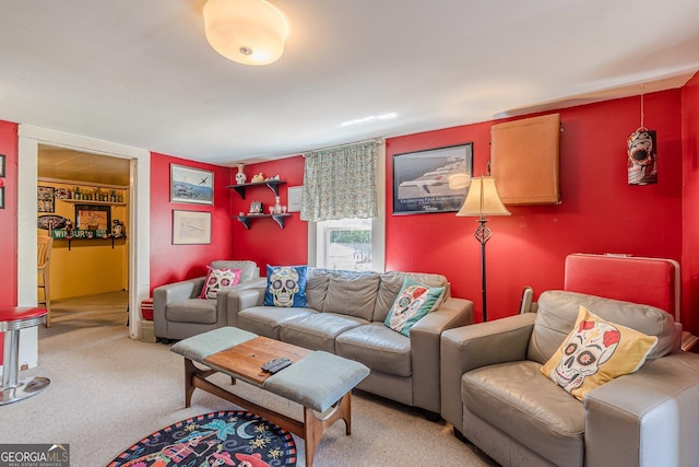 living area featuring light carpet