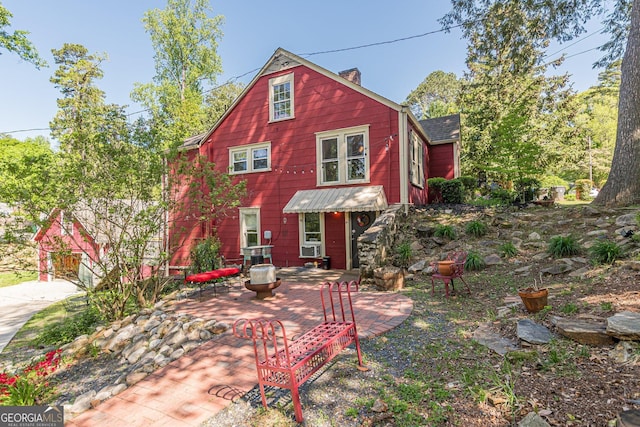 view of front of house with a chimney