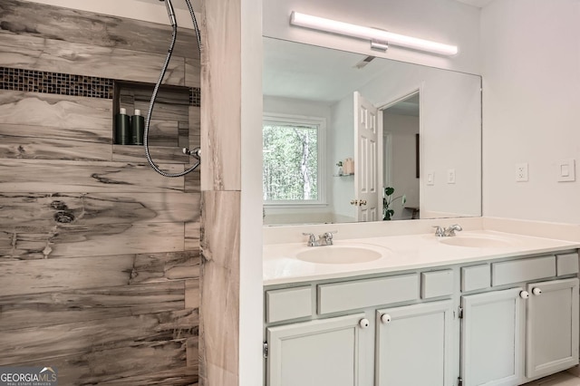 bathroom featuring double vanity and a sink