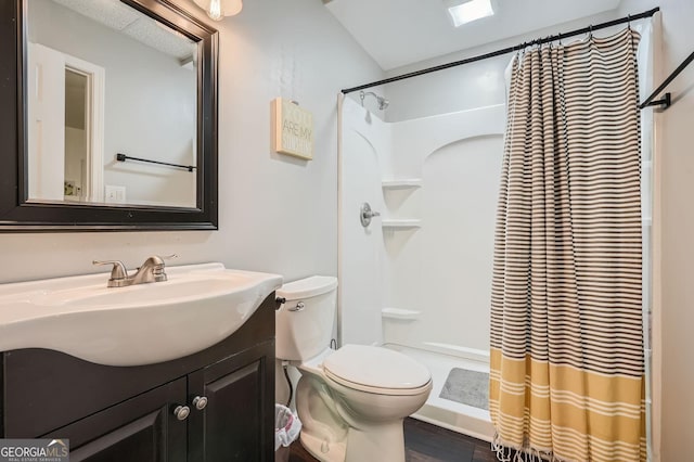 full bath with vanity, curtained shower, toilet, and wood finished floors