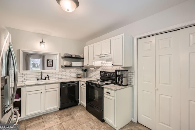 kitchen with white cabinetry, a sink, black appliances, and tasteful backsplash