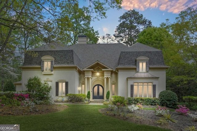 315 Mossy Pointe, Duluth, GA 30097 - view of front of house featuring a lawn, a shingled roof, a chimney, and stucco siding