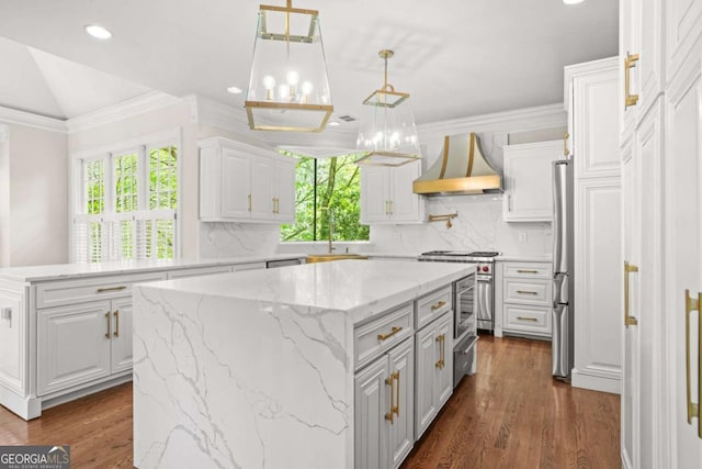 315 Mossy Pointe, Duluth, GA 30097 - kitchen with dark wood-style floors, backsplash, a center island, white cabinetry, and custom range hood
