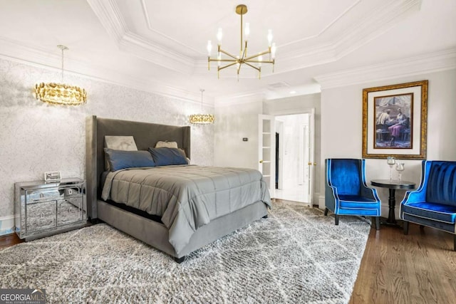 315 Mossy Pointe, Duluth, GA 30097 - bedroom featuring crown molding, a notable chandelier, wood finished floors, and a raised ceiling