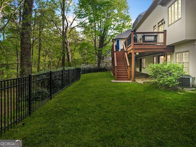 315 Mossy Pointe, Duluth, GA 30097 - view of yard with a wooden deck, central AC unit, a fenced backyard, and stairway
