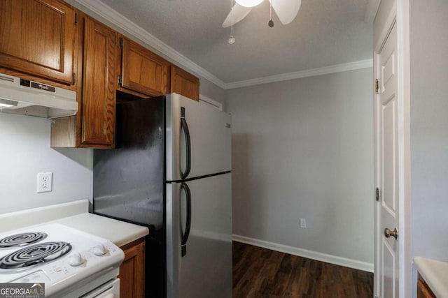 kitchen with freestanding refrigerator, under cabinet range hood, white range with electric cooktop, crown molding, and brown cabinetry
