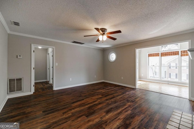 unfurnished living room featuring dark wood-type flooring, ceiling fan, a textured ceiling, baseboards, and ornamental molding