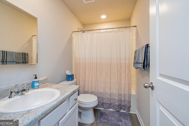 full bath with shower / bath combination with curtain, toilet, vanity, and visible vents