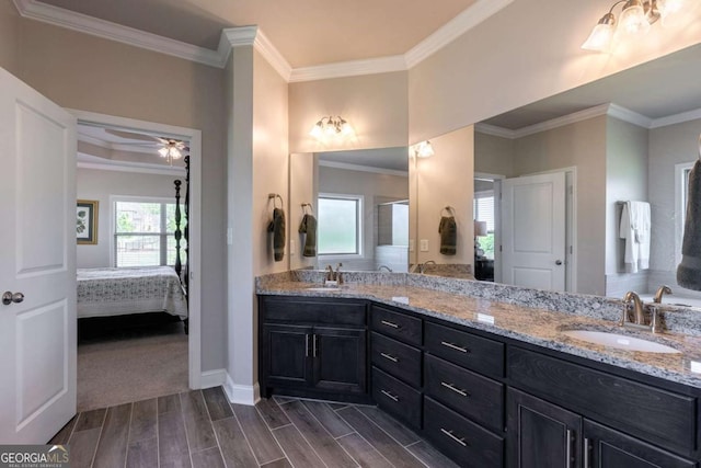 2424 Princeton Bend Way, Bogart, GA 30622 - ensuite bathroom with crown molding, wood tiled floors, double vanity, and ceiling fan