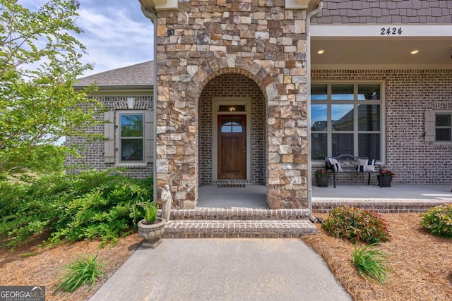 2424 Princeton Bend Way, Bogart, GA 30622 - view of exterior entry with stone siding and covered porch