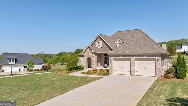 2424 Princeton Bend Way, Bogart, GA 30622 - traditional home featuring a garage, a front lawn, driveway, and brick siding